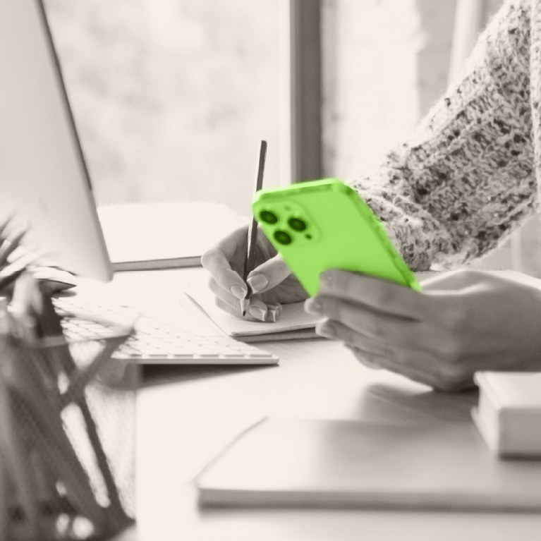 green calculator with a hand