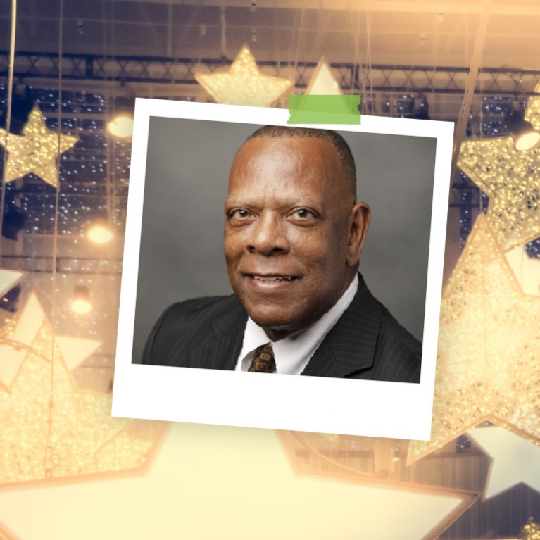 color headshot of Michael Ray VP of Business Developement against background with gold stars and sparkles