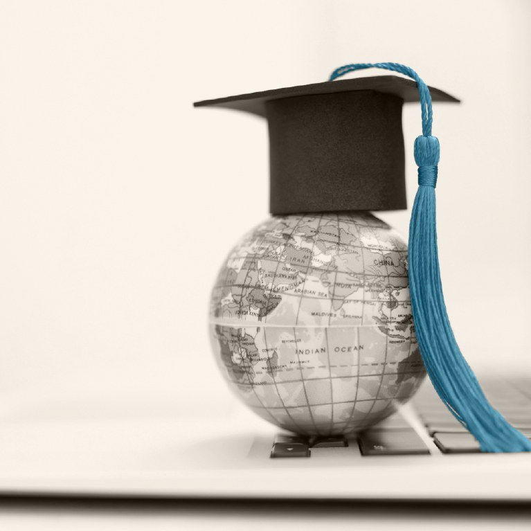 globe with graduation cap on it