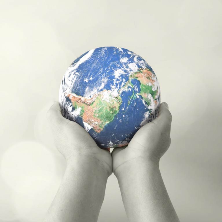 hands holding a globe