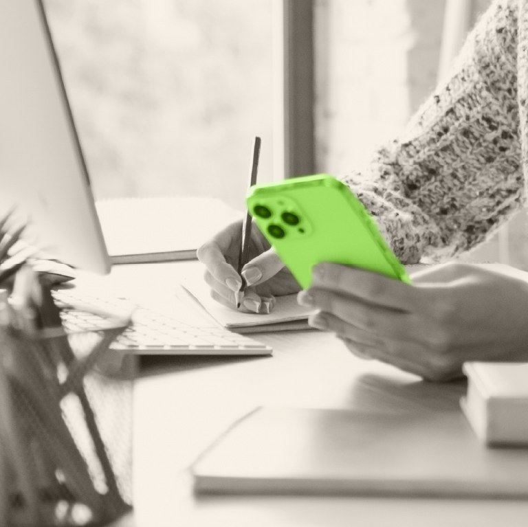 hand over a green calculator