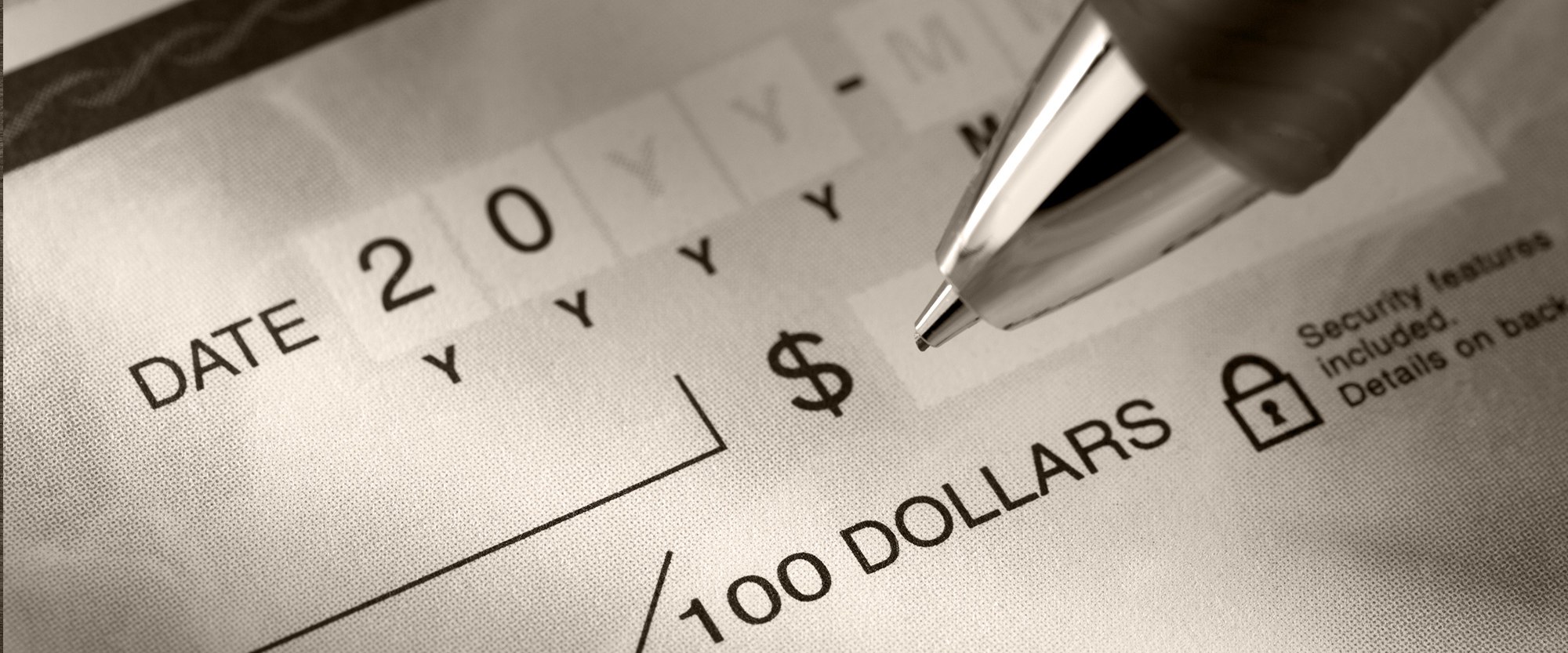 pen filling out money order form