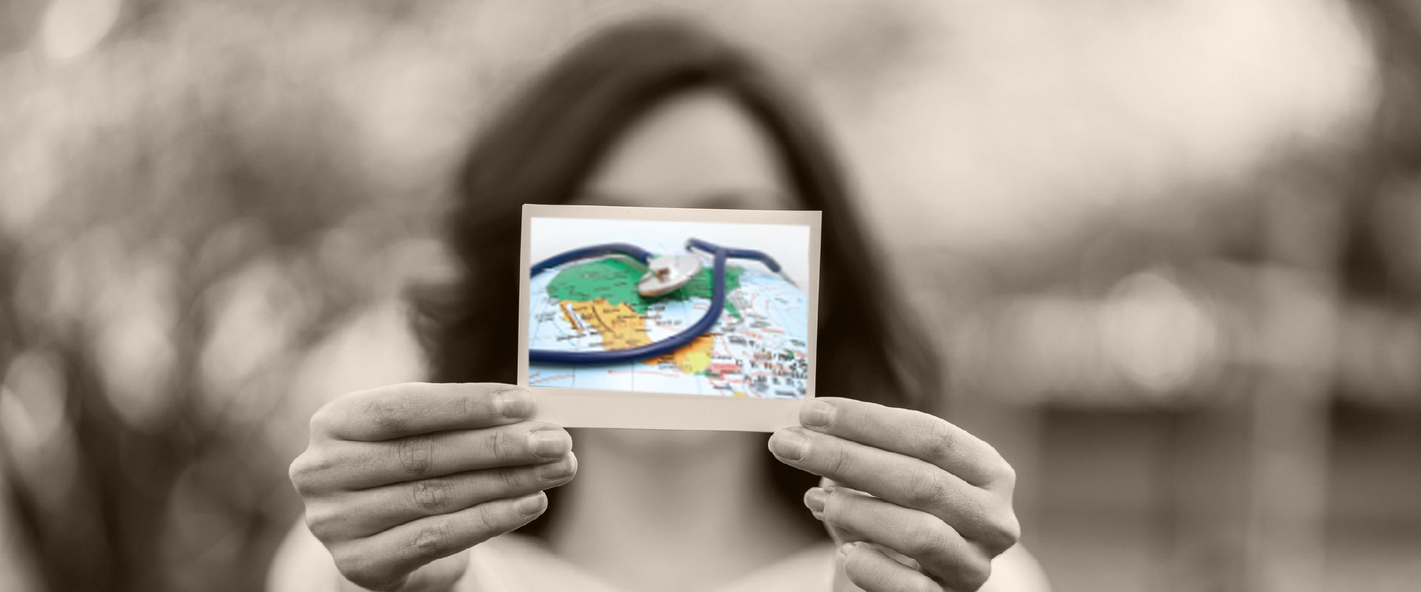 Women holding photo of a stethoscope