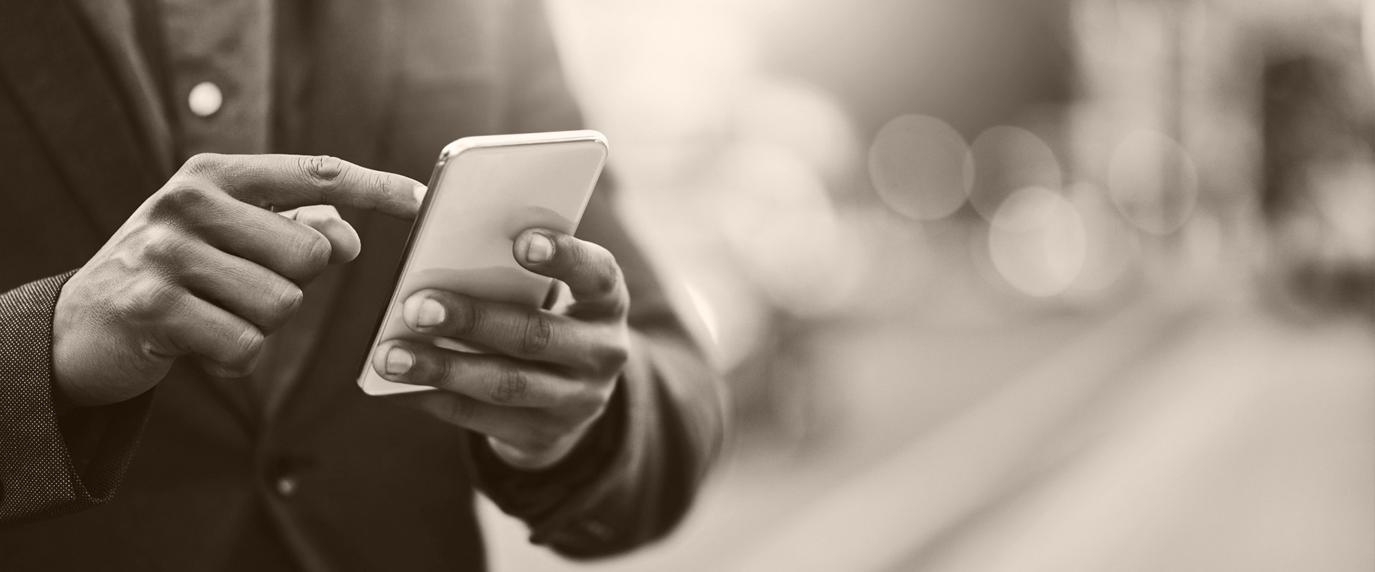 Person typing on a mobile device