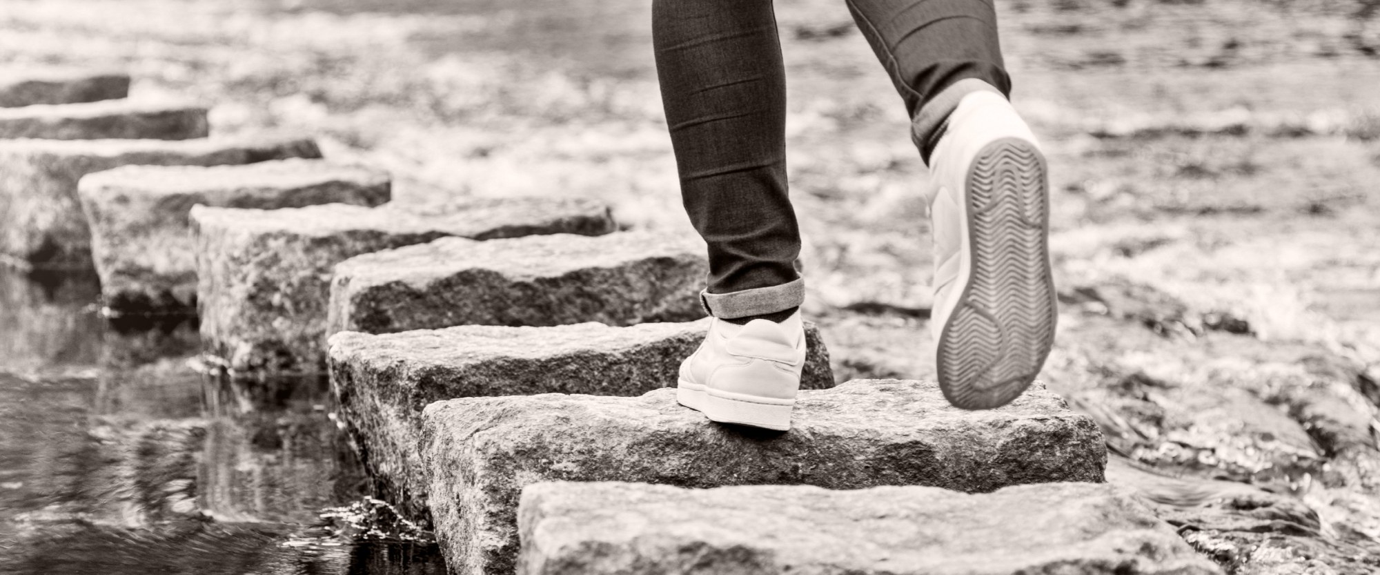 feet walking on stones