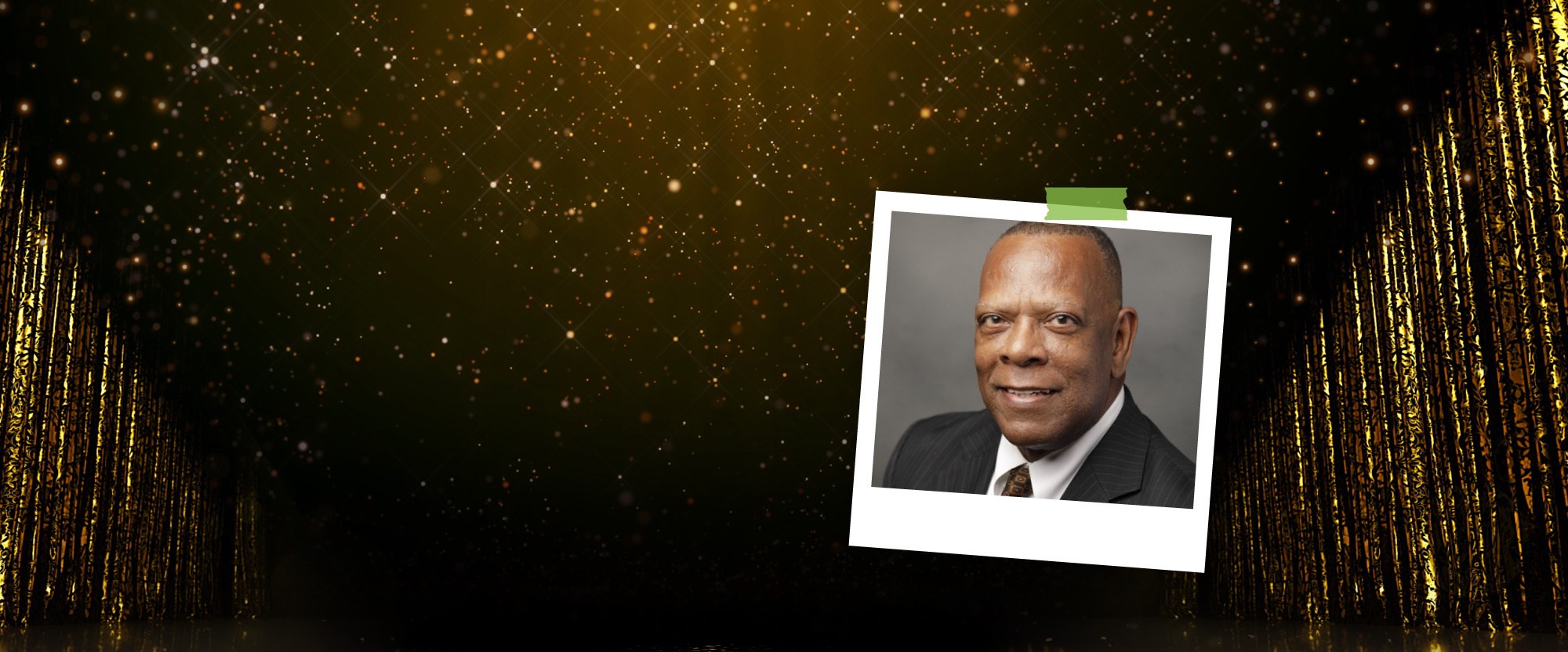 polaroid image of pahofcu vp Michael Ray against a wood background with gold glitter