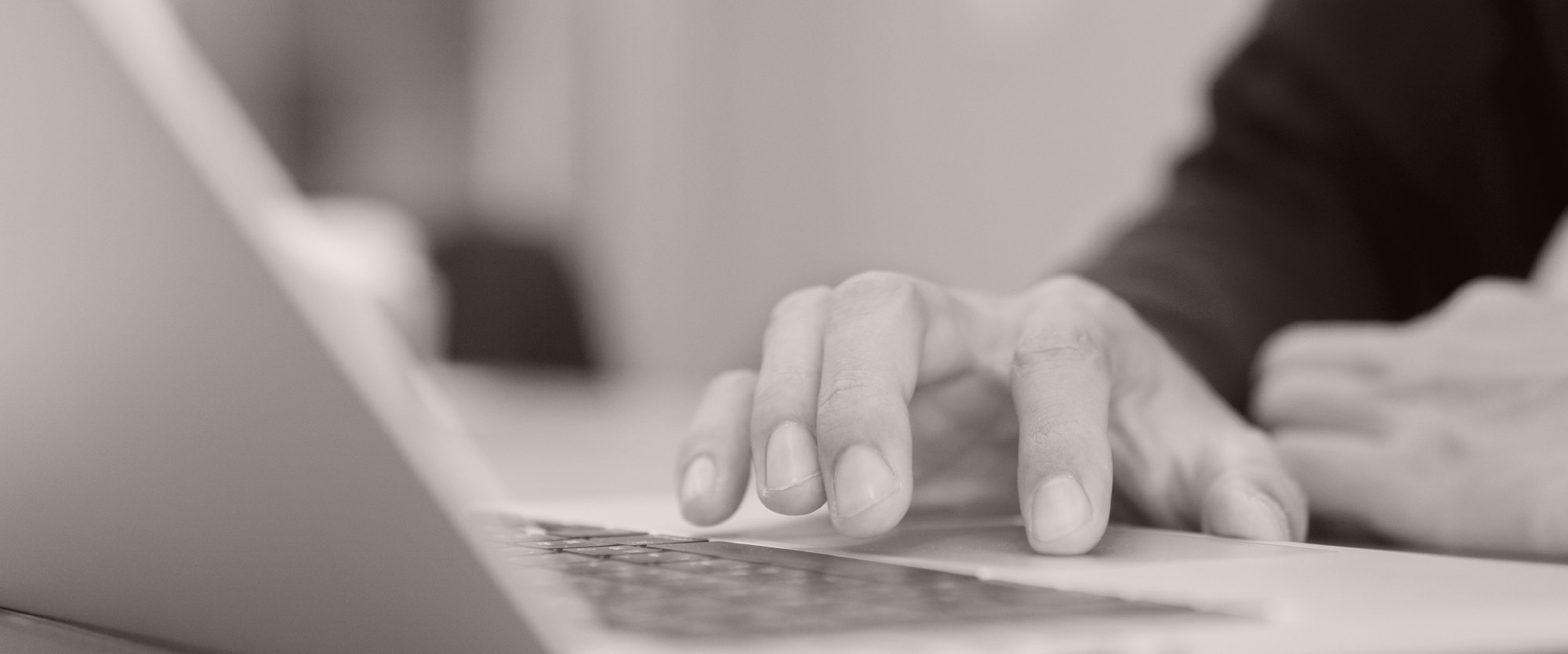 hands on a laptop keyboard