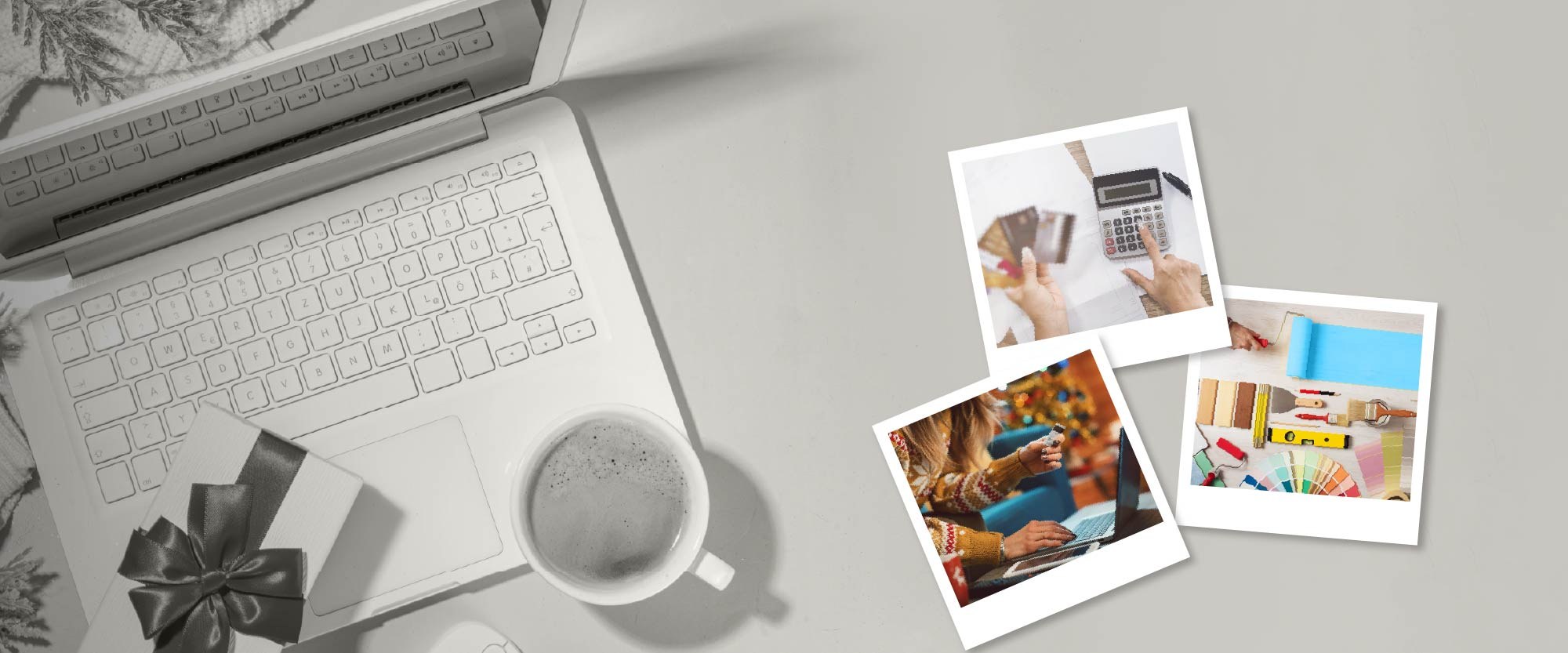 wooden board background with a present next to a laptop with 3 polaroids  one with an image of someone at laptop another of hand at calculator and third is of paint swatches