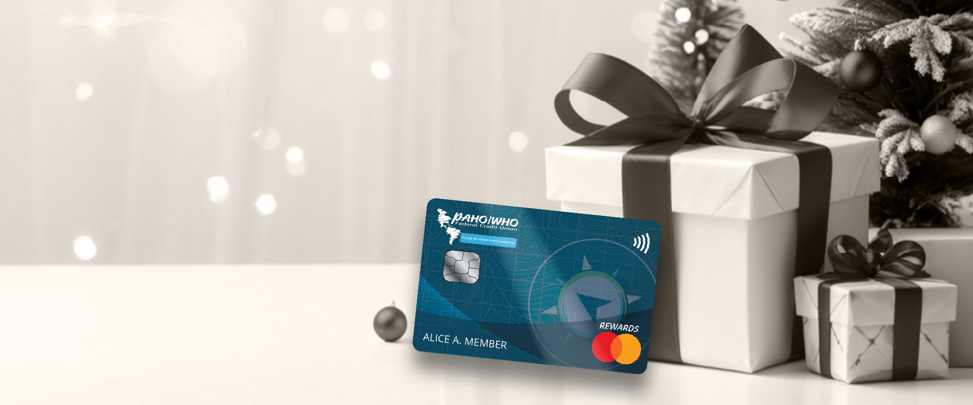 laptop glasses and a World rewards card on a desk