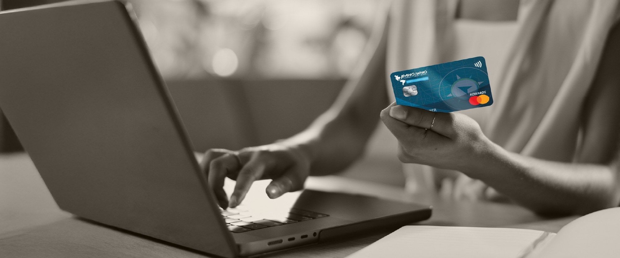 paying with a World rewards card on a desk