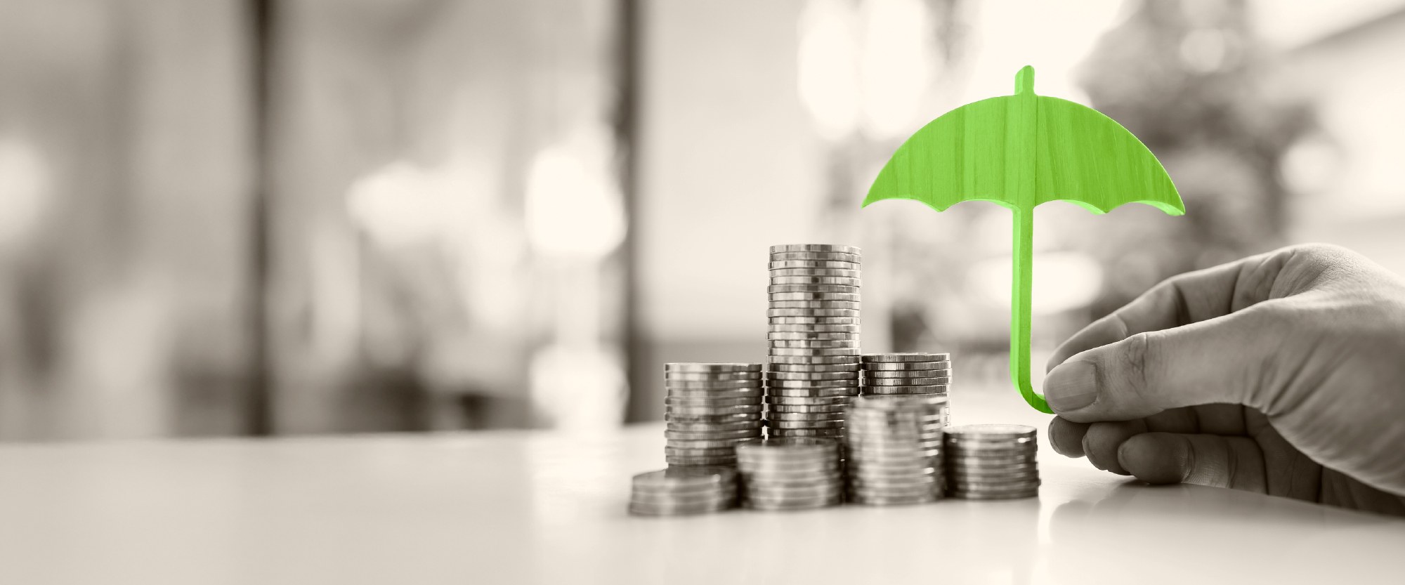 money with green umbrella over it