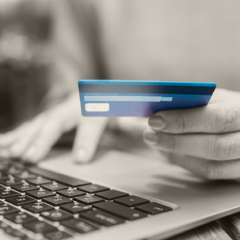 Person making online payment with credit card