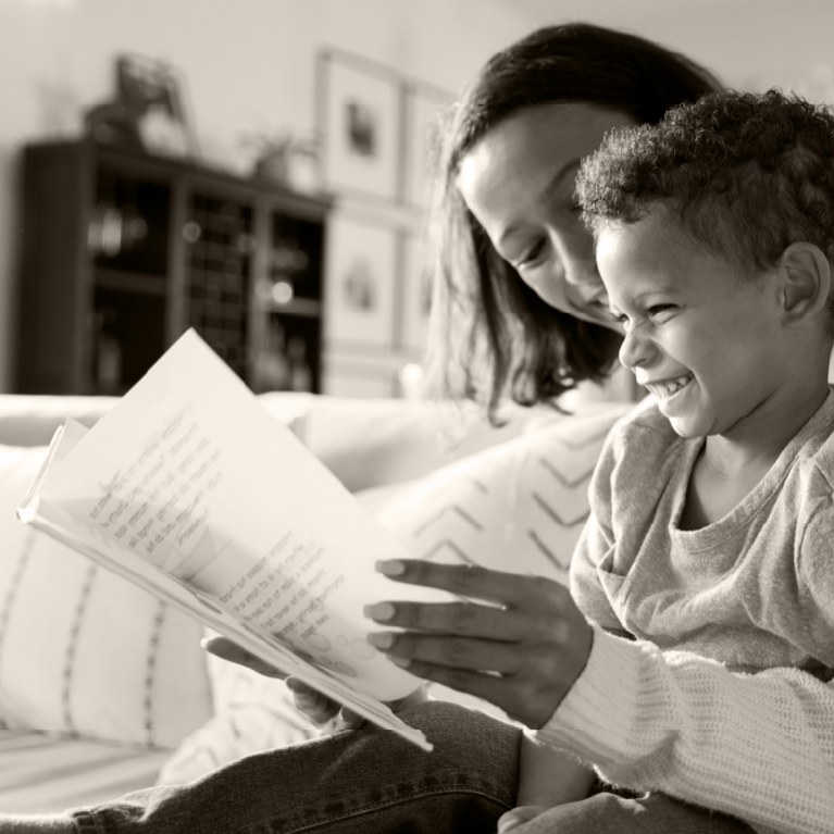 A mother reading to her child.