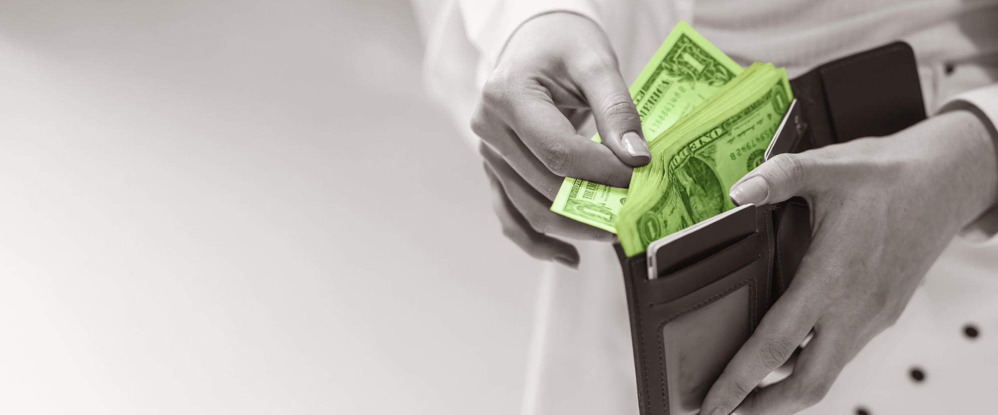 open wallet with dollar bills