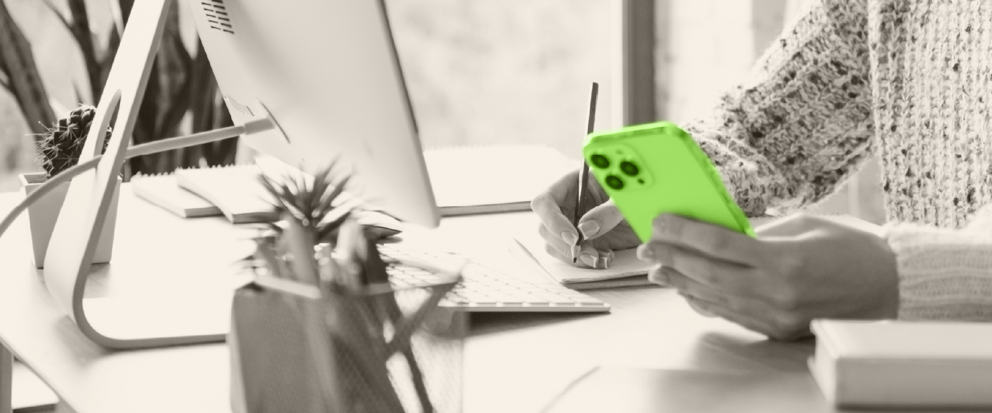 hand over a green calculator