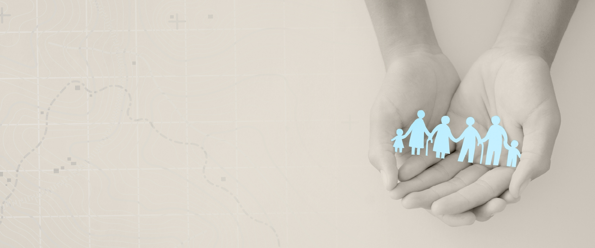 hands with paper coutout of family in blue