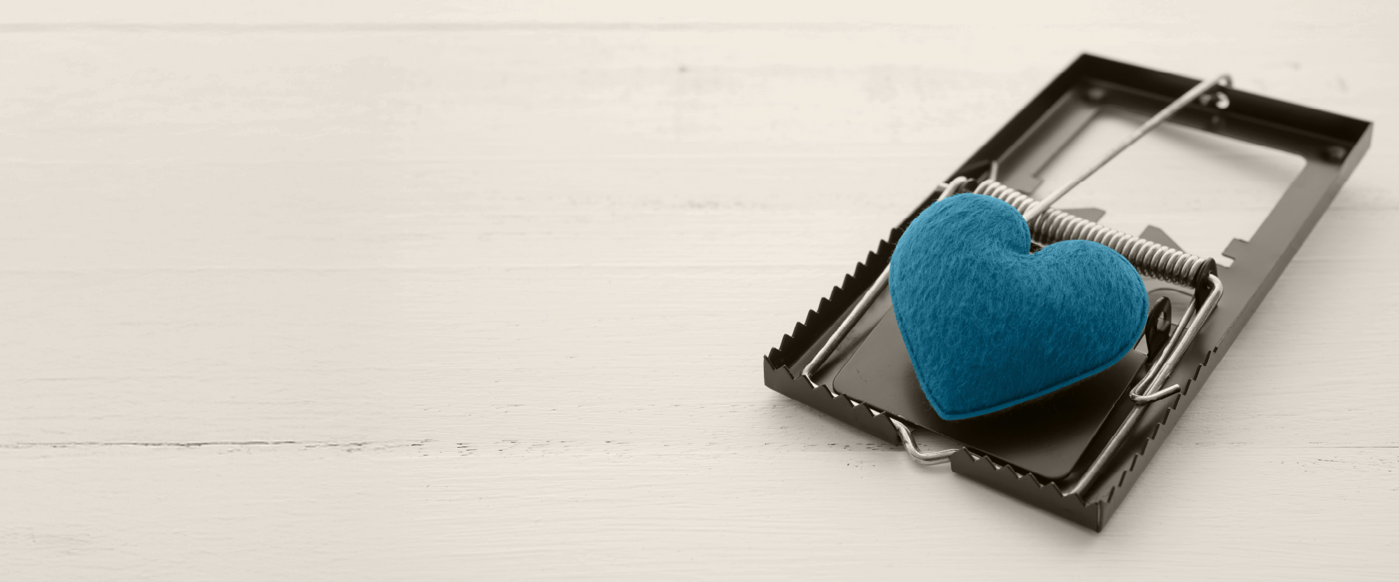 turquoise heart in a mousetrap